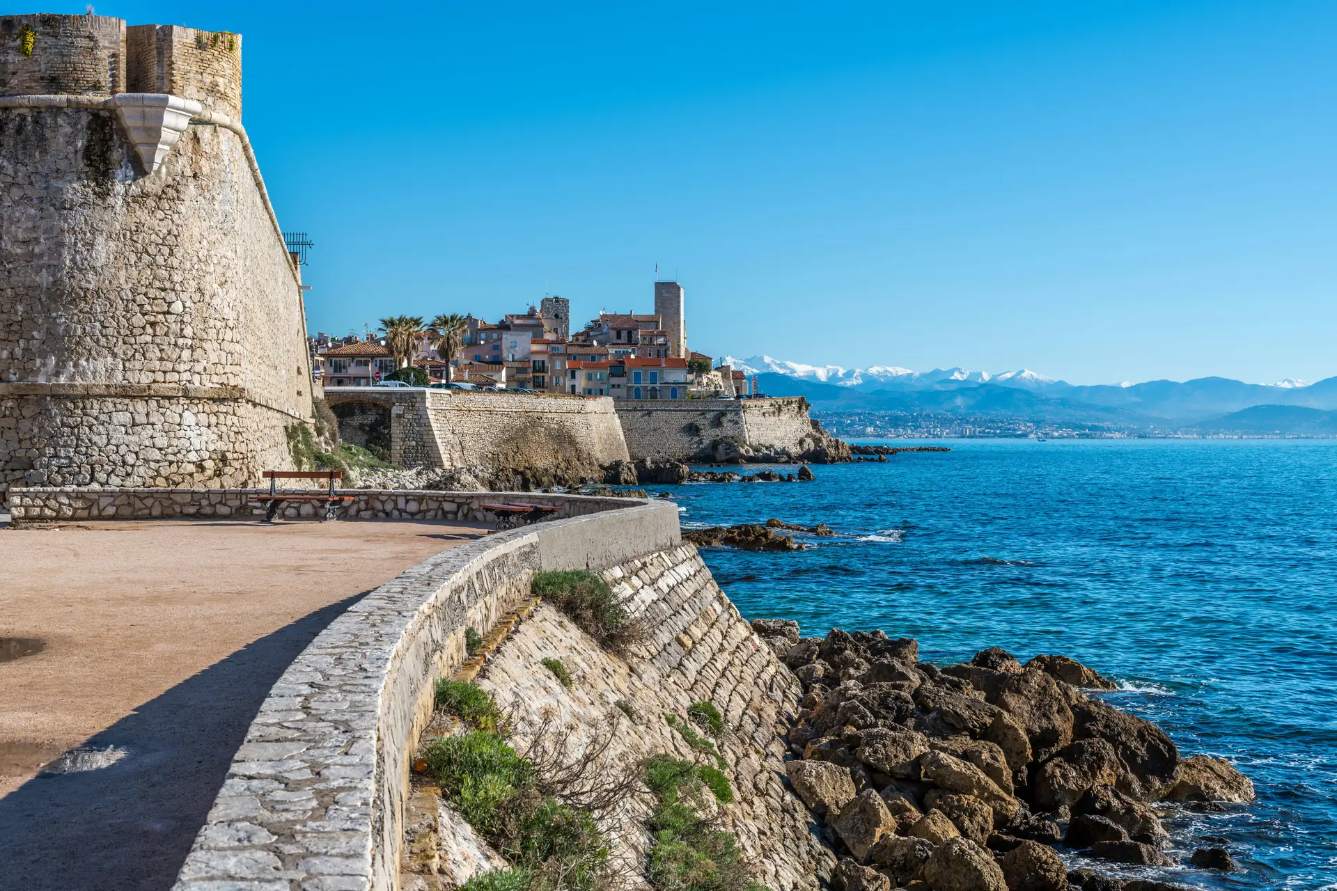 Old town walls and blue Mediterranean Sea in Antibes, French Riviera, France