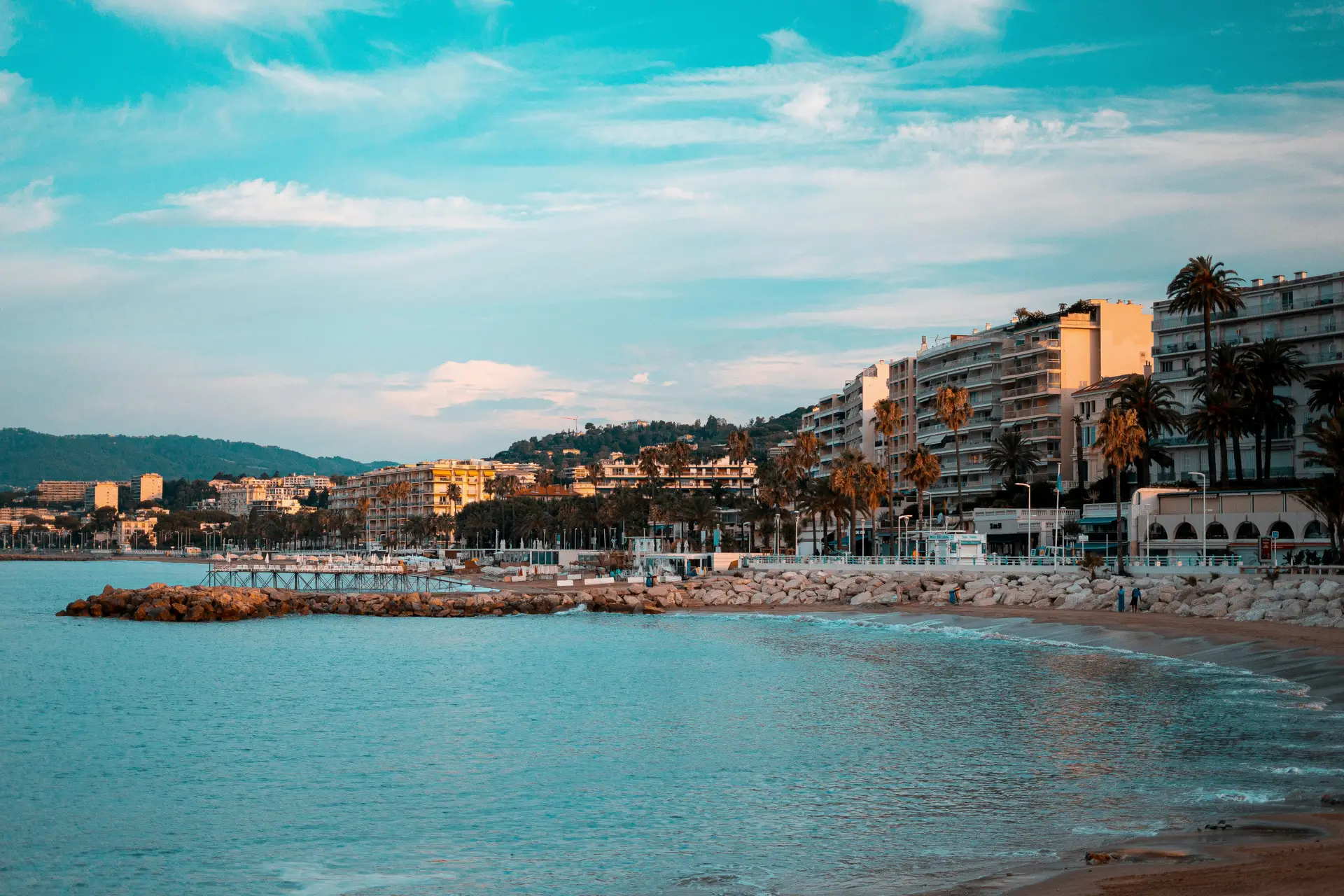 Cannes beach and luxury hotels during sunset