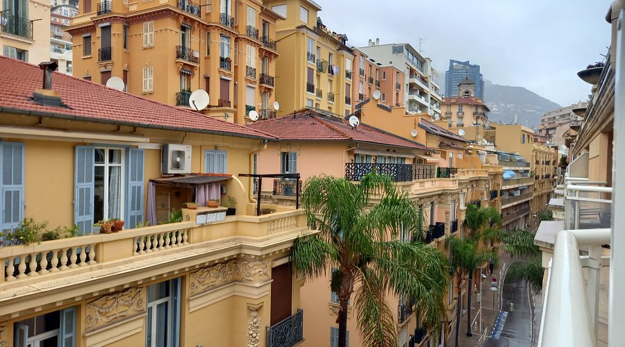 Facade of Aparthotel Adagio Monaco across from the port