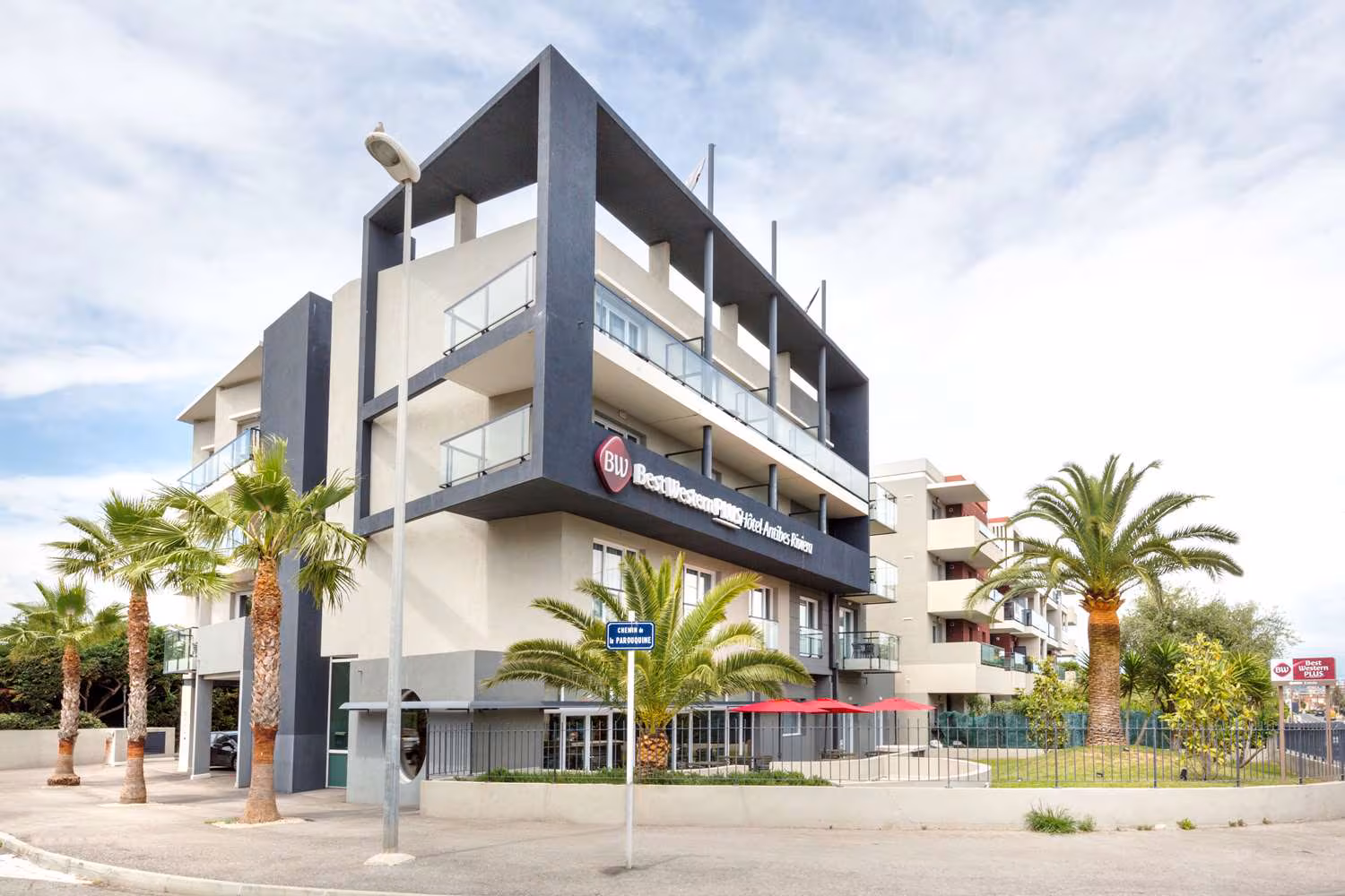 Best Western Plus Antibes Riviera – Modern Comfort Near the Côte d’Azur Beaches Exterior view of Best Western Plus Antibes Riviera hotel with modern architecture and nearby palm trees