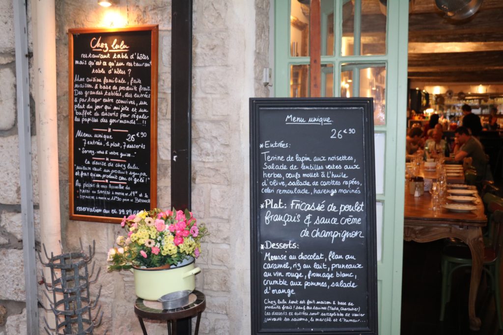 Chez Lulu - Cozy Local Dining in Antibes Chez Lulu Antibes entrance with chalkboard menu and rustic interior