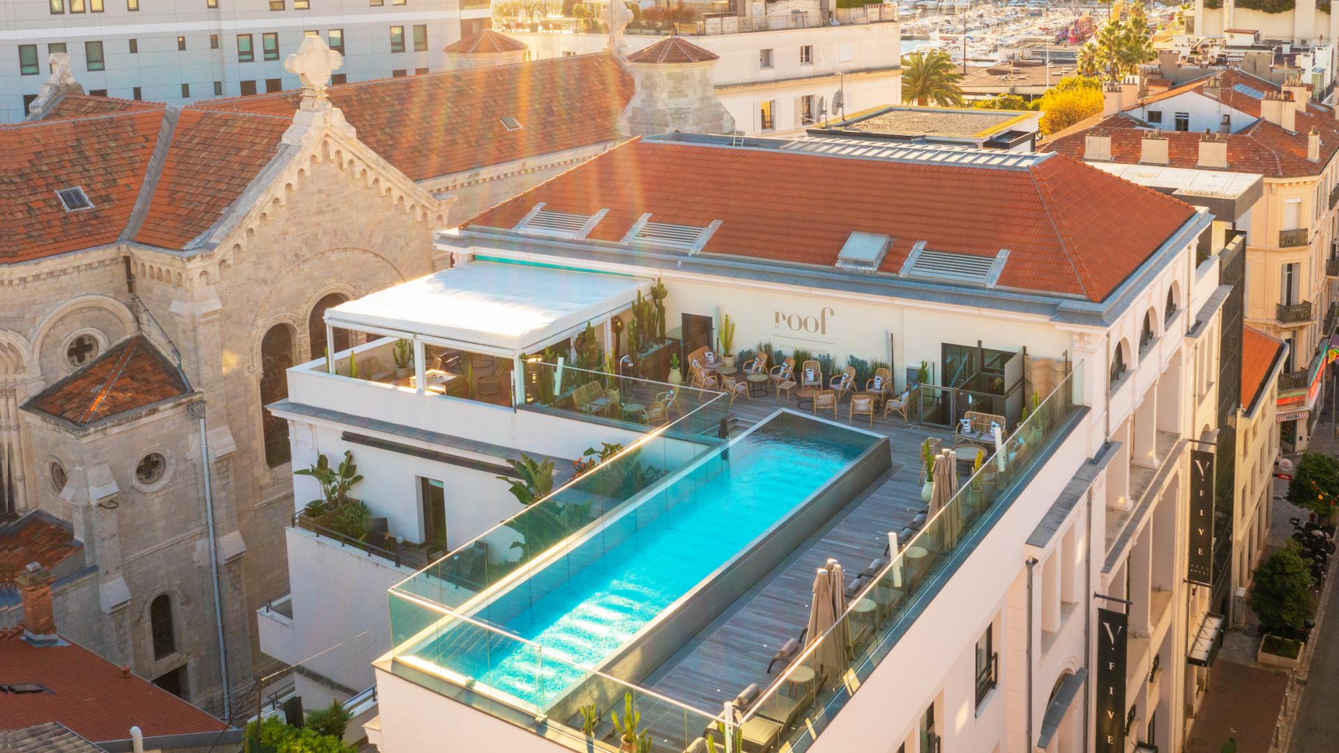 Five Seas Hotel Cannes – Chic Boutique Stay Rooftop view of Five Seas Hotel Cannes with pool and city backdrop