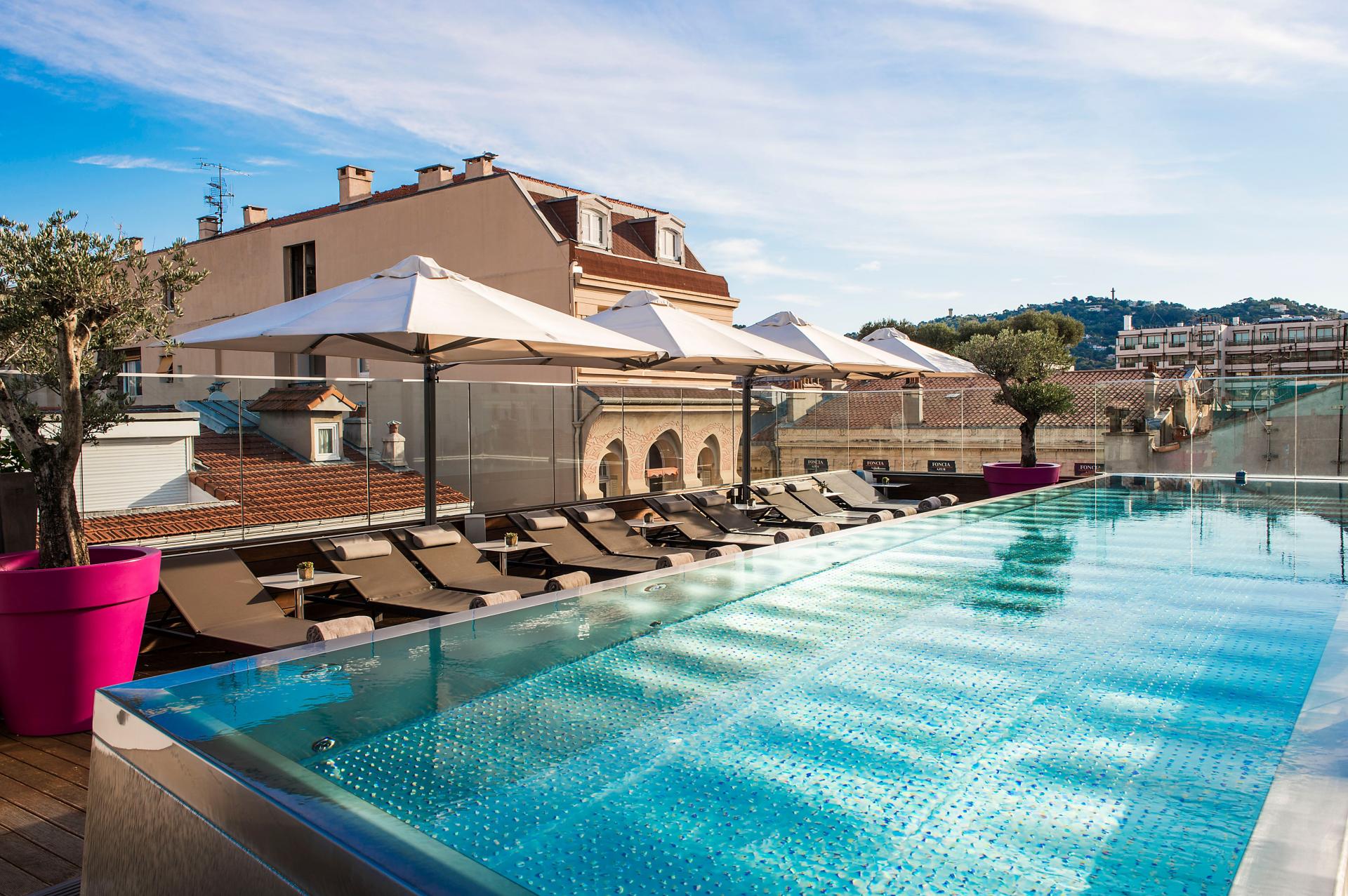 Luxury rooftop escape at Five Seas Hotel Cannes Rooftop pool with sunbeds at the stylish Five Seas Hotel