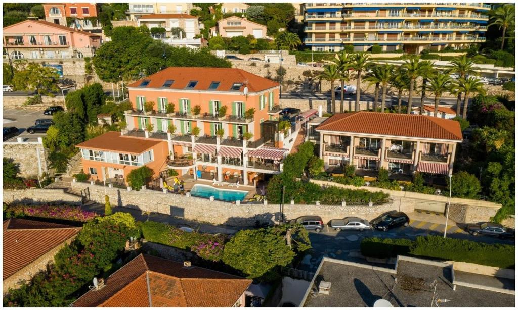 Hotel La Flore – Comfortable hillside hotel with sea views Aerial view of Hotel La Flore overlooking Villefranche bay