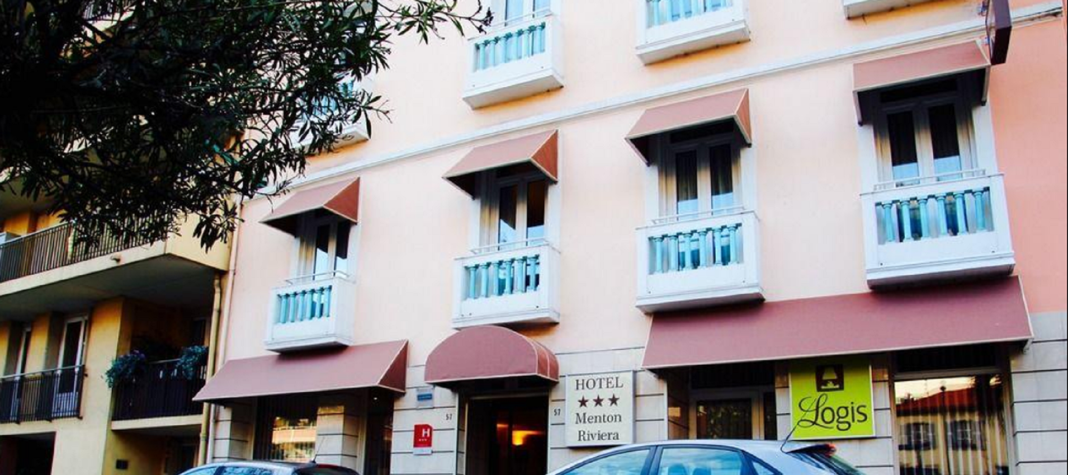 Hotel Menton Riviera – Central budget hotel with beach access Peach-toned façade of Hotel Menton Riviera with classic windows