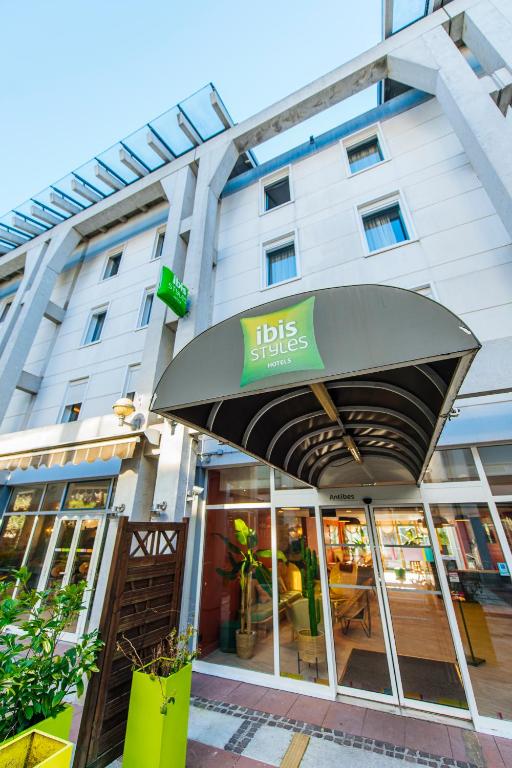 Ibis Styles Antibes – Budget-Friendly Hotel with Modern Amenities Colorful exterior entrance of Ibis Styles Antibes Hotel with canopy and greenery