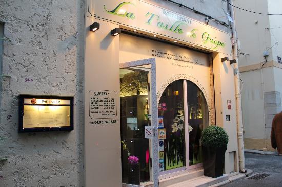 La Taille de Guêpe - Artistic Dining in Antibes Entrance of La Taille de Guêpe restaurant with floral decor in Antibes