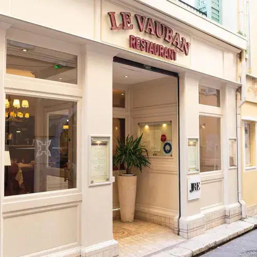 Le Vauban - Gourmet French Restaurant in Antibes Exterior of Le Vauban gourmet restaurant with white facade in Antibes