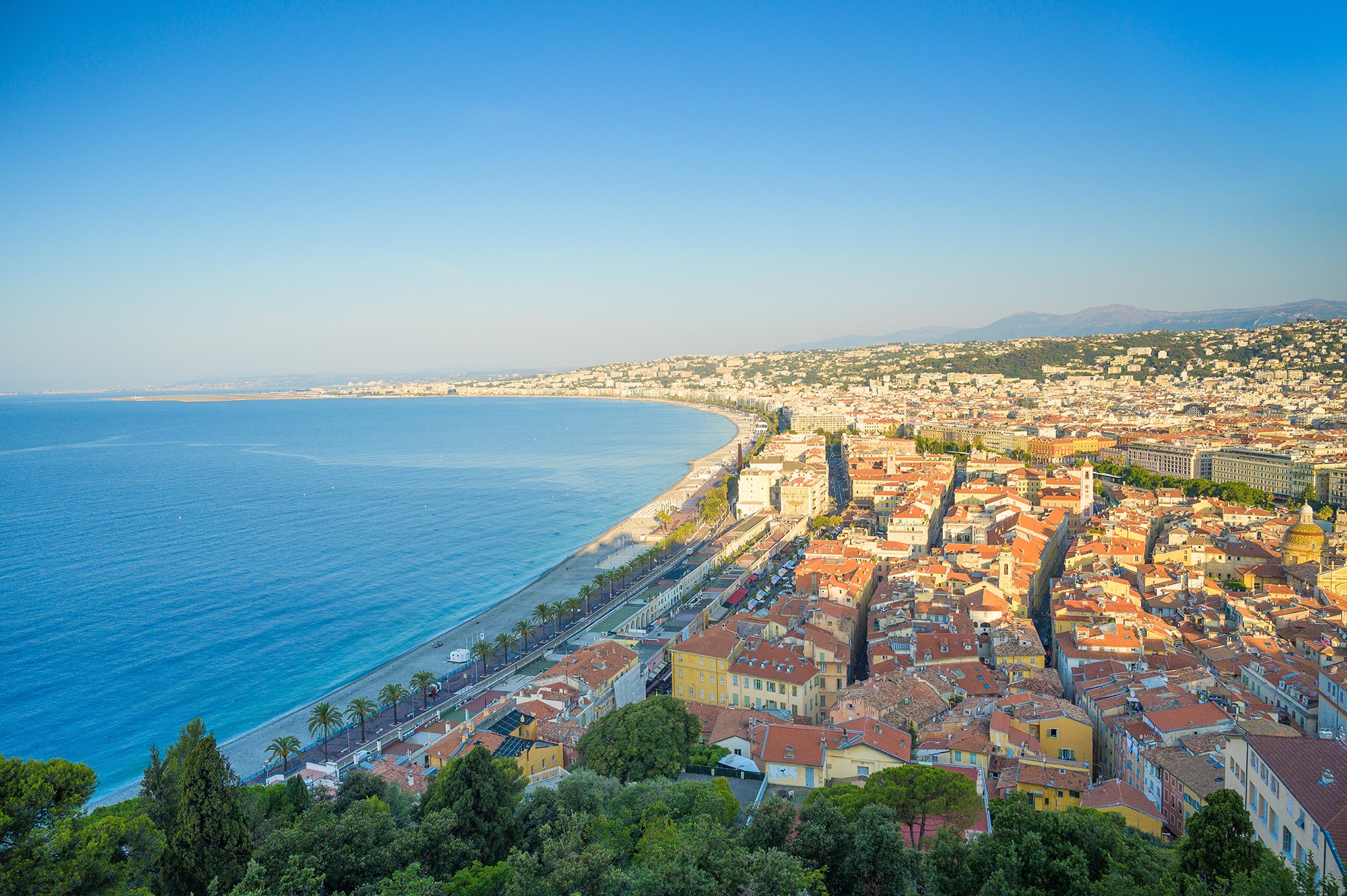 Explore the Best 8 Cities of the French Riviera. Promenade des Anglais and cityscape of Nice along the curved Baie des Anges