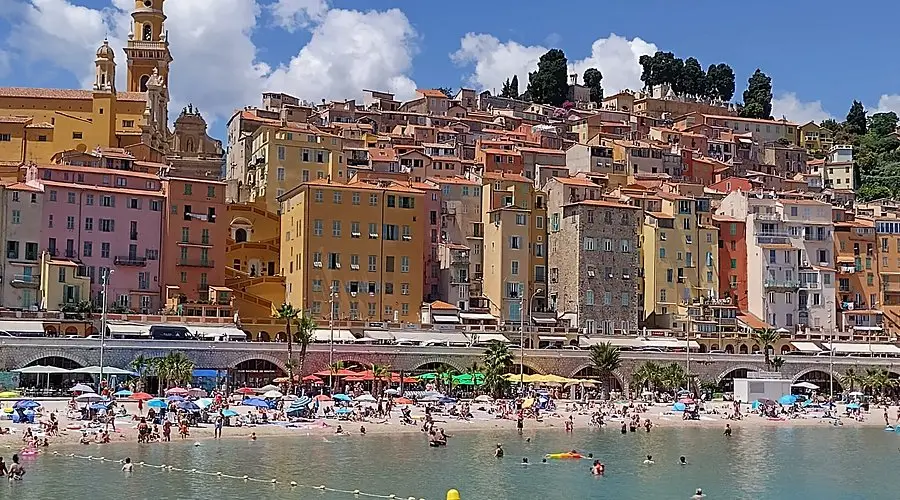 Plage des Sablettes – Relaxing Riviera Beach in Menton Sandy beach and umbrellas on Plage des Sablettes