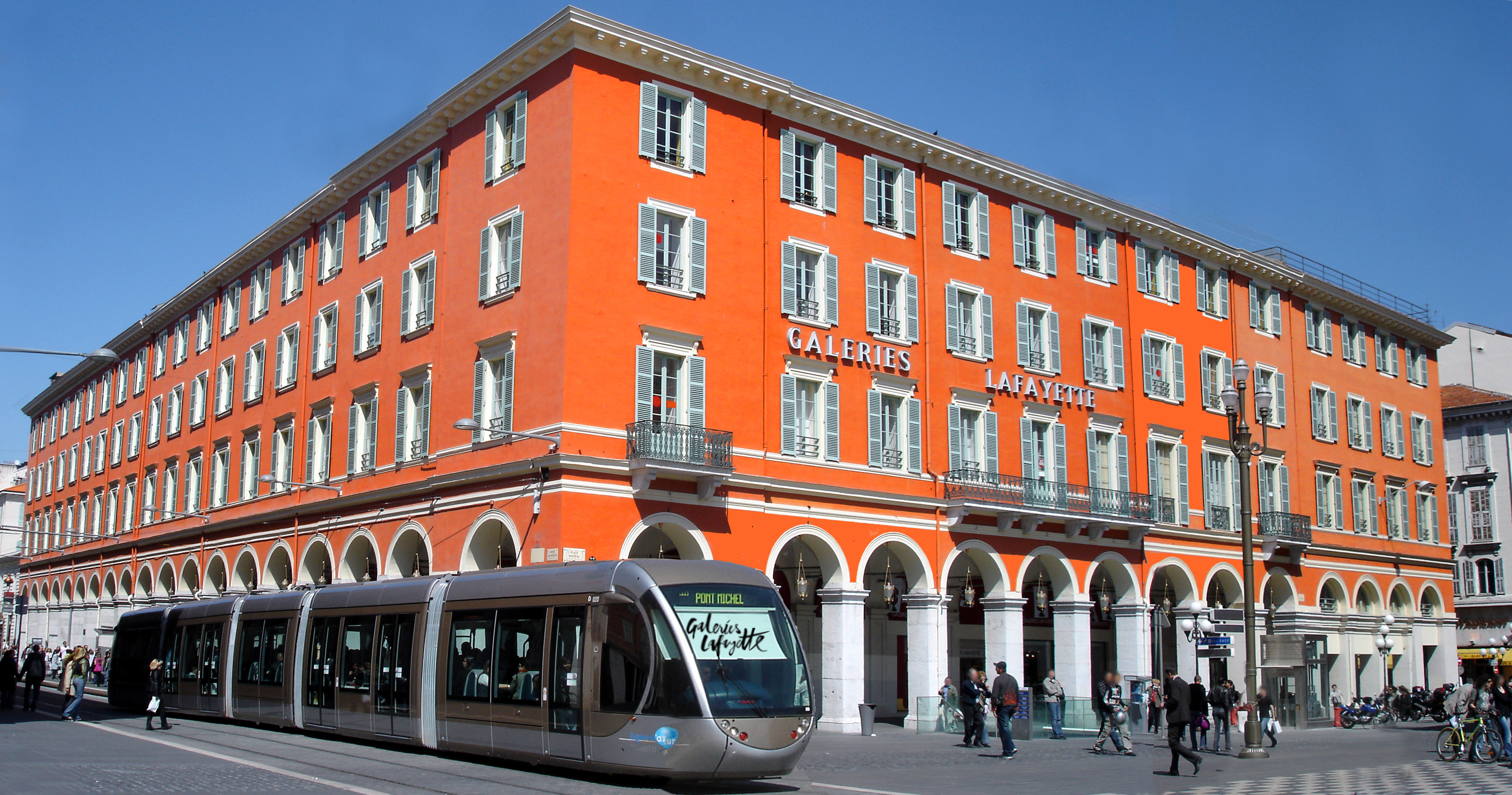 Galeries Lafayette Nice – Fashion & Gourmet All in One Place Department store facade with tram in front of Galeries Lafayette in Nice