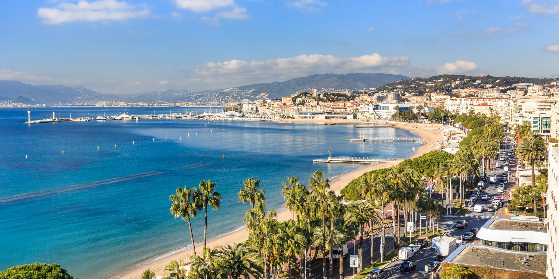 La Croisette – Cannes’ iconic seafront Palm-lined La Croisette boulevard with beach clubs and promenade
