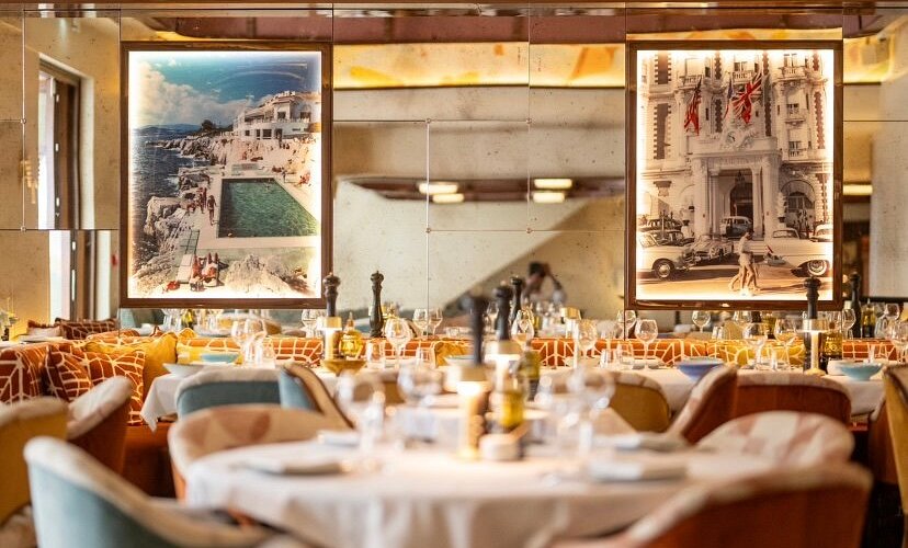 La Môme Cannes – trendy rooftop dining and seafood cuisine Interior of La Môme restaurant in Cannes with retro Riviera decor