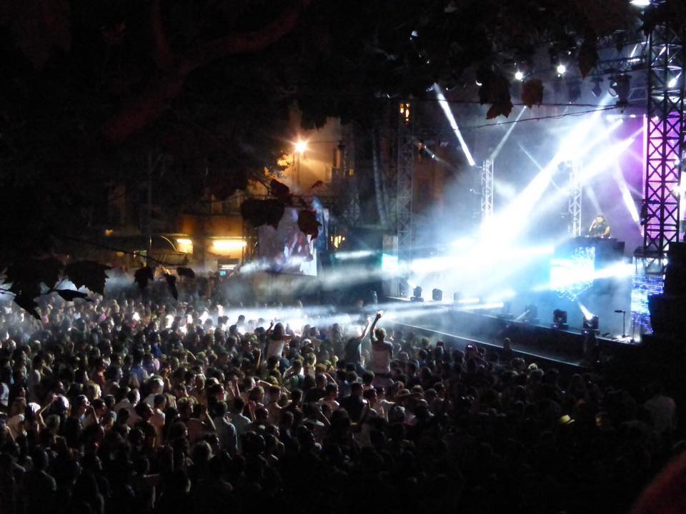 World music rhythms in a hilltop town Crowd enjoying a night concert in Vence