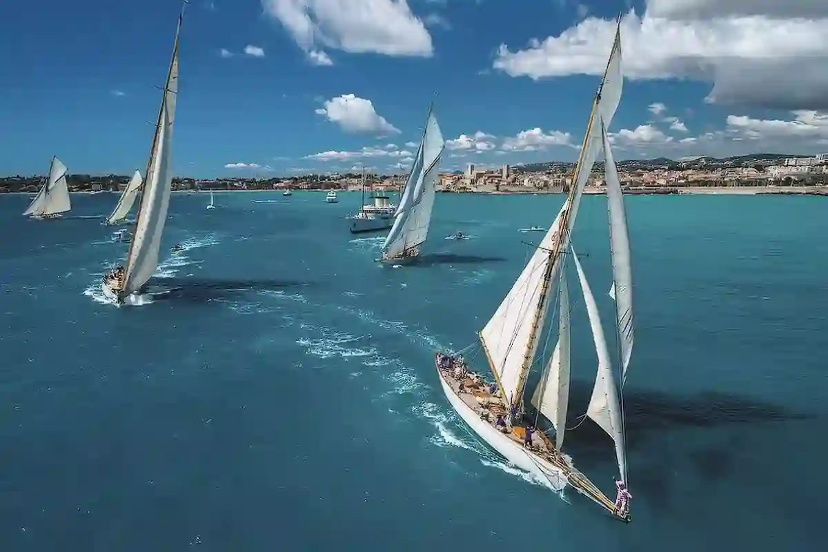 Les Voiles d’Antibes – Prestigious Sailing Event on the French Riviera Classic sailboats racing across turquoise waters during Les Voiles d’Antibes