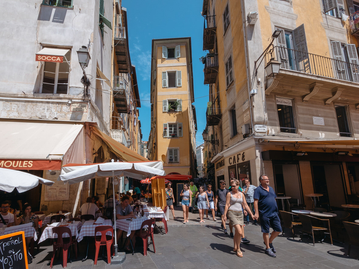 Vieux Nice street life – Culture and cuisine People walking through colorful Vieux Nice street cafés