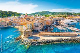 Aerial view of Saint-Tropez harbor with yachts, old town, and clear blue water