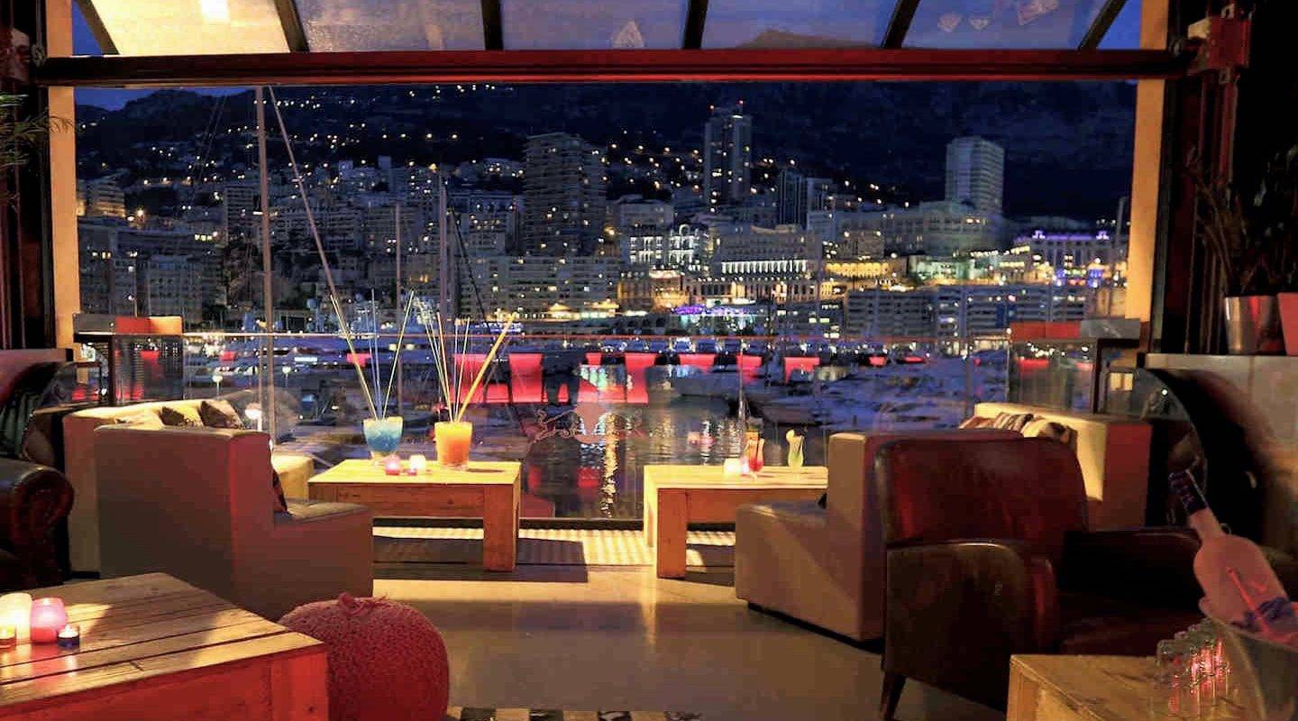 Stars'n'Bars Monaco – Casual American Dining with a Port View Stars'n'Bars lounge view over Port Hercules at night