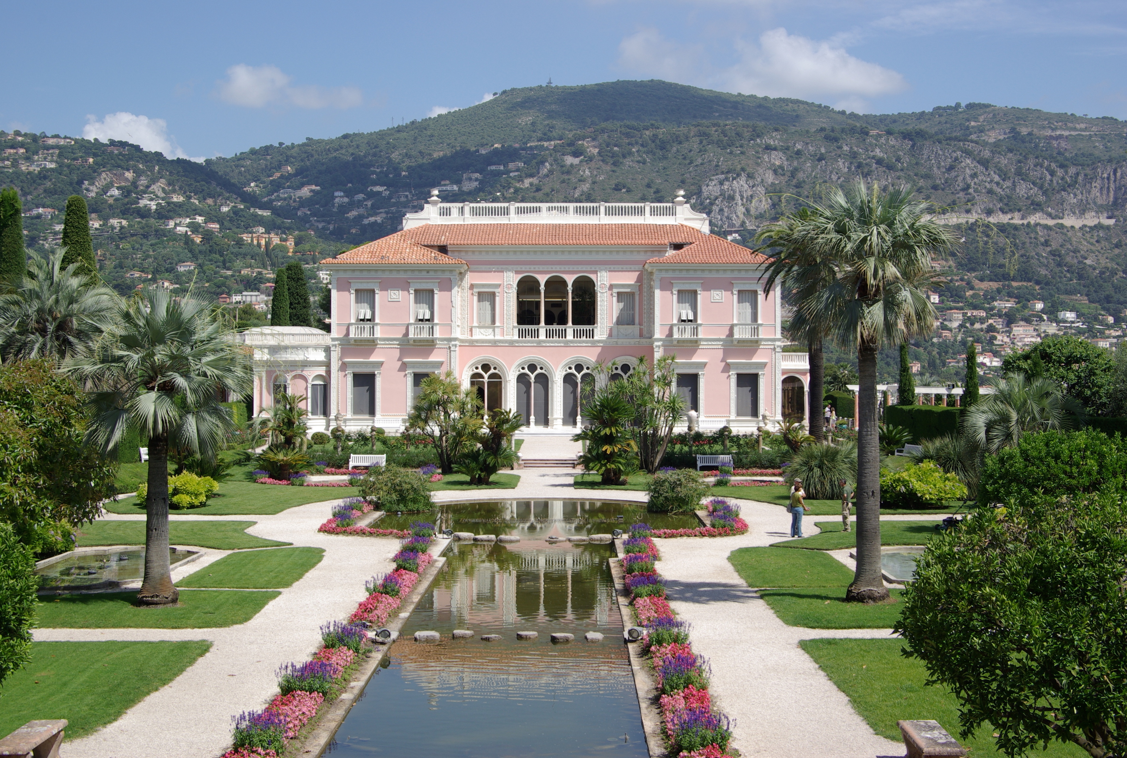 Villa Ephrussi – Palatial Estate and Garden Jewel of Cap-Ferrat Elegant pink villa with lush gardens and fountains overlooking Cap-Ferrat